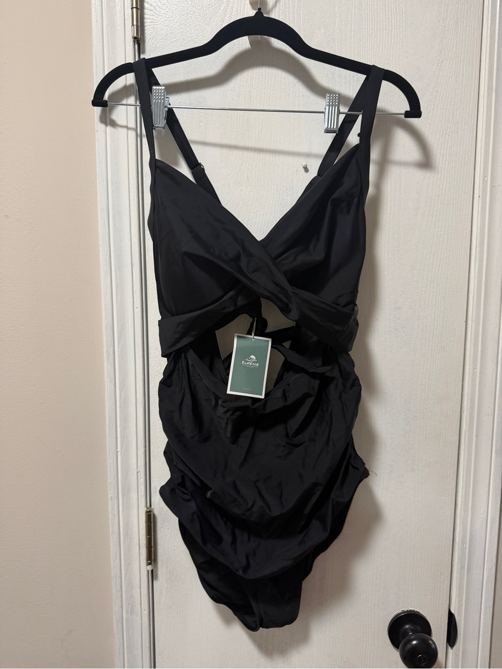 Black One-Piece Swimsuit with Twist Front and cutouts. NWT